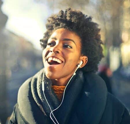 IELTS Energy 1480 - Recent IELTS Forum Listening Questions and Expert Answers Girl listening to earphones happy