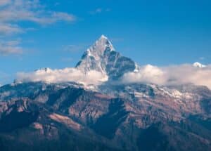 IELTS Energy 1493 - Mistakes You Make With “High” and “Tall” photo of a mountain peak in clouds