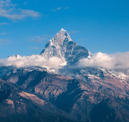IELTS Energy 1493 - Mistakes You Make With “High” and “Tall” photo of a mountain peak in clouds